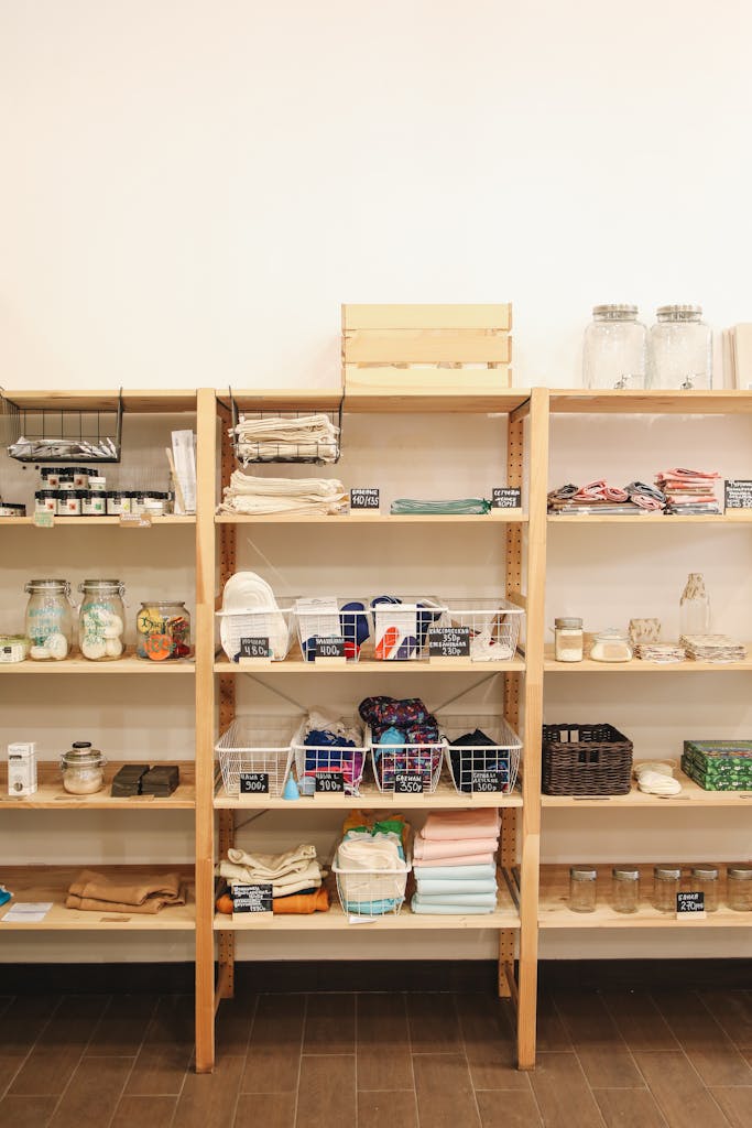A wooden shelf display showcasing eco-friendly products in a zero waste store.